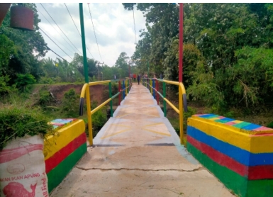 Jembatan Versi Vera, Dari PTPN I Regional 7 Bekri untuk Tetangga